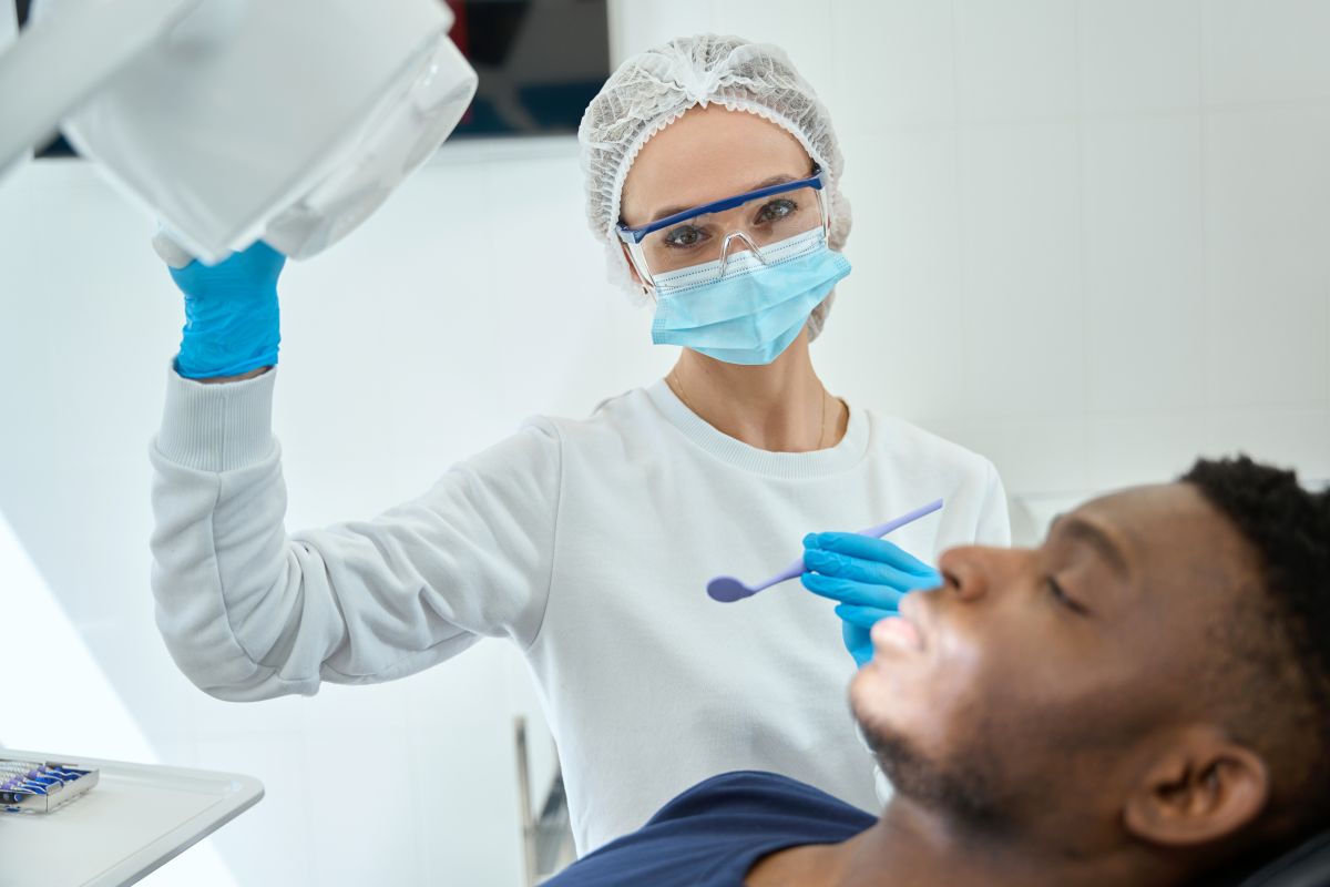 woman-doctor-adjusting-equipment-in-the-dentistry-2024-10-20-10-08-43-utc - Fairlington Dental
