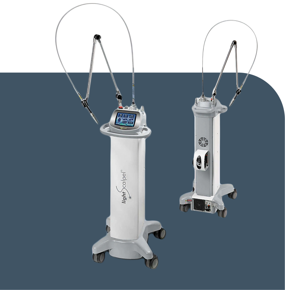 Two medical laser devices on wheeled stands with flexible fiber-optic arms, prepared for surgical or cosmetic laser procedures.